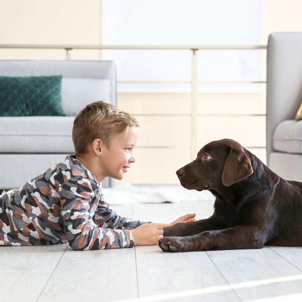kid and dog on floor